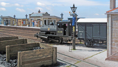 This is the supply of 2 coal bunkers 324 one has 2 bays and the other has 3 bays. These coal bunkers are supplied in brown and can be painted and weathered accordingly.  00  Gauge Scale 1.76